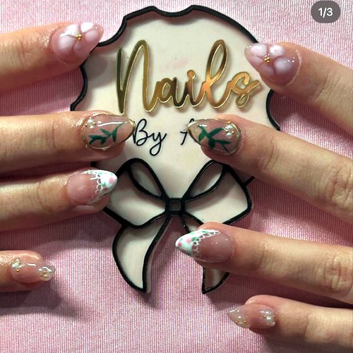 Nail art by Ava with her bow sign